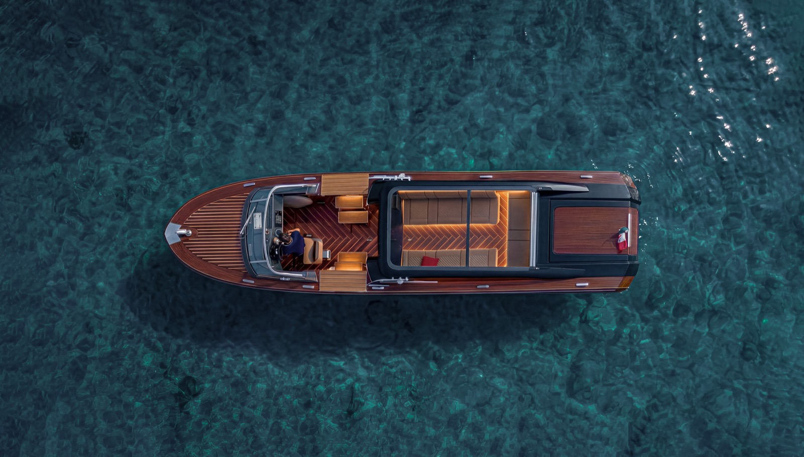 Private water limousine seen from above on clear water