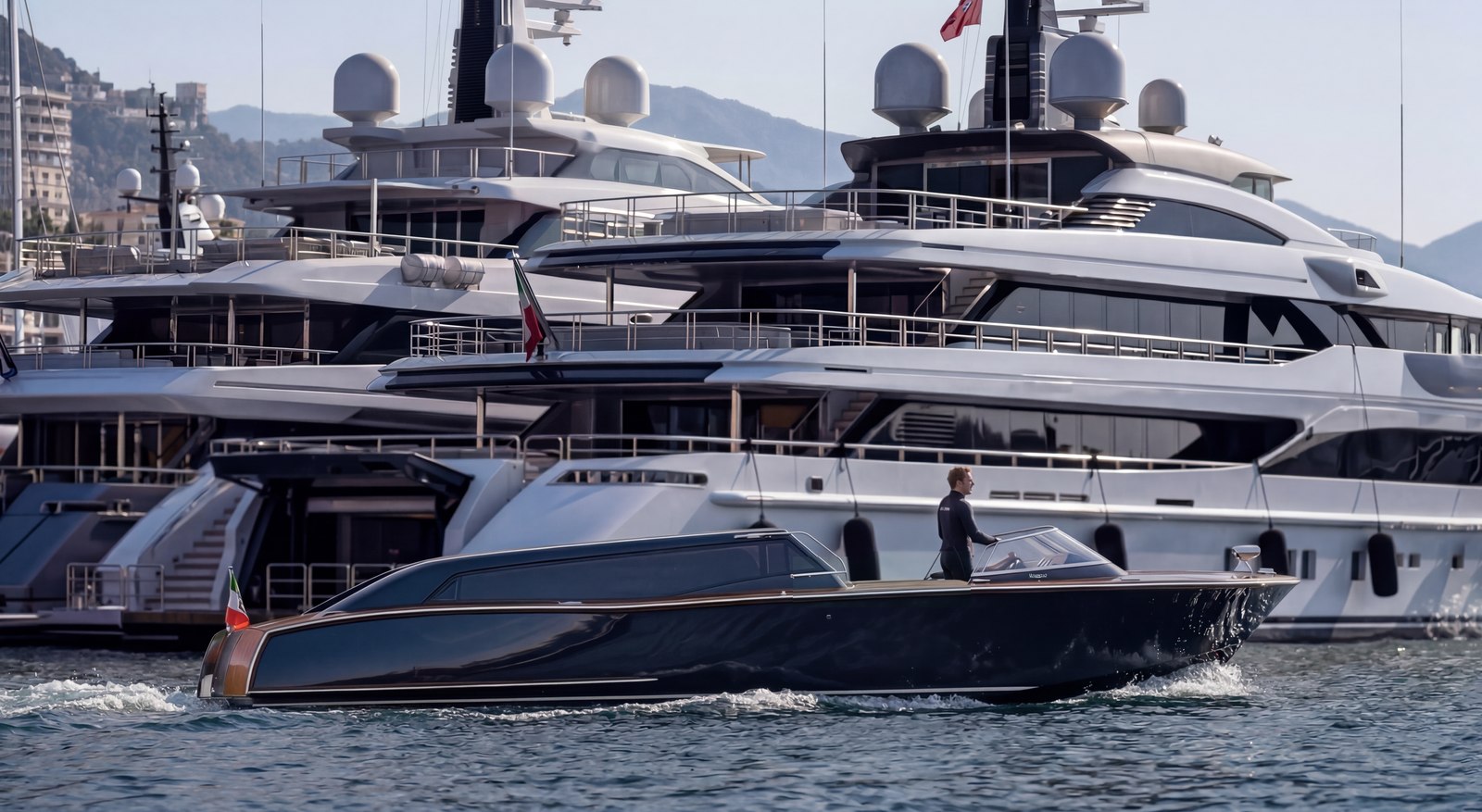Vizianello Thunder water limousine beside superyachts